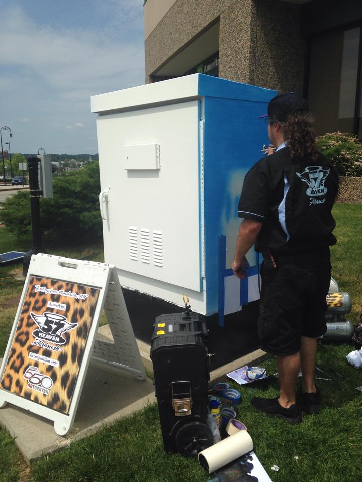 Robert Sardella working on his art project outside the Verizon Wireless Arena.