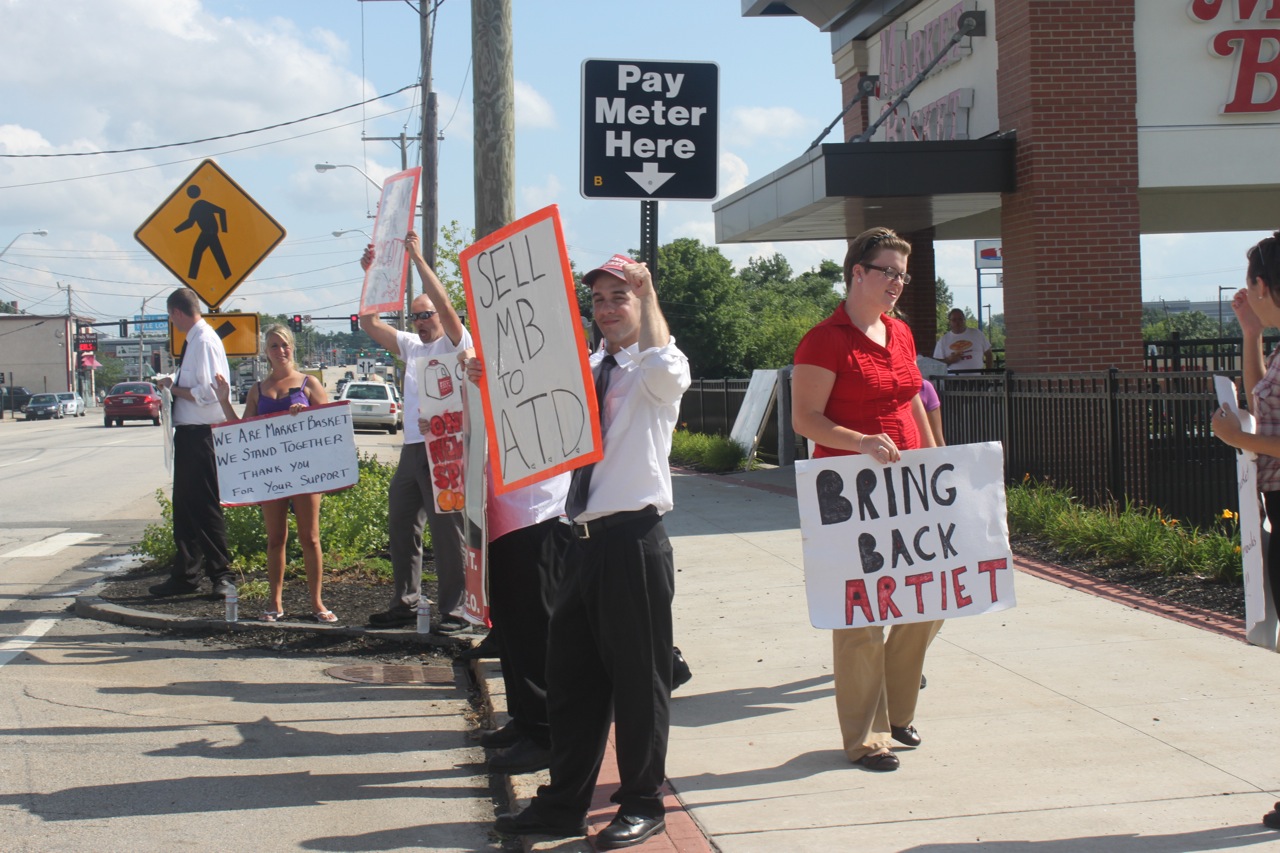 Employees outside the Manchester Market Basket on Elm Street.