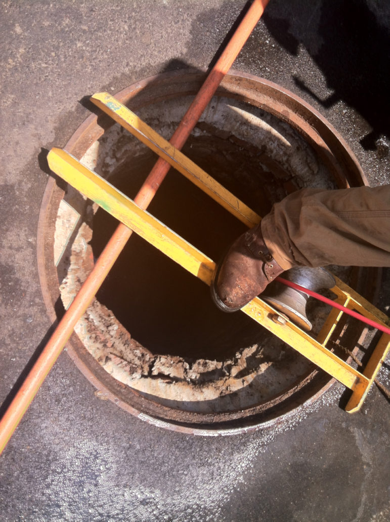 A small orange cable attached to a small camera, to help crews assess damage to underground pipes.