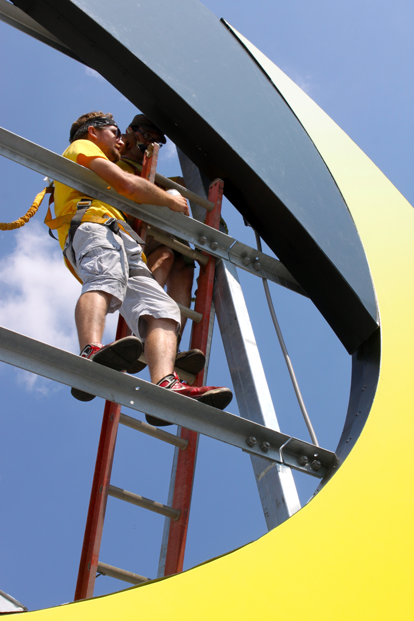 Chad Dean and Jay Aubertin installing the new Dyn sign.