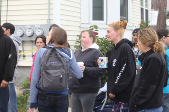 Parents huddle outside the school during lockdown.