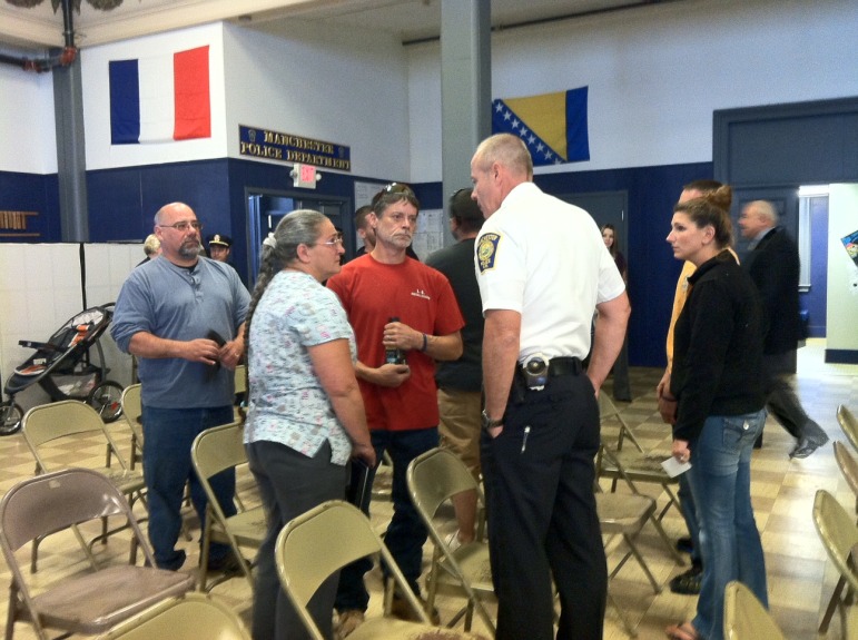Christopher Gagnon's family speaks with Asst. Chief Nick Willard during a recent Manchester Police event. Their son, Christopher, was stabbed to death in February 2014.