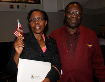 Philomene Uwamariya, a native of Rwanda, left, became a U.S. citizen Friday. Her husband Manasse Karuhura, would like to become a citizen, also.