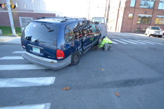 A disabled van was towed from the scene of an accident involving a Manchester Police SUV, which was responding to an earlier accident involving a police cruiser.