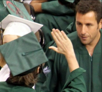 Adam Sandler gets a high-five from Central HS graduate in 2010.