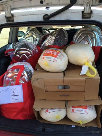 A load of turkeys and dinner bags, packed and ready to deliver.