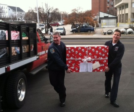 Members of the Manchester Fire Department with a special delivery.
