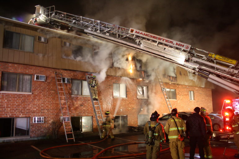 Manchester firefighters battle the Dec. 21  blaze at 65 Log Street.