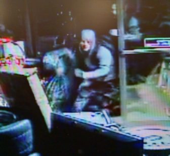 Pawn shop video still of possible burglary suspect.