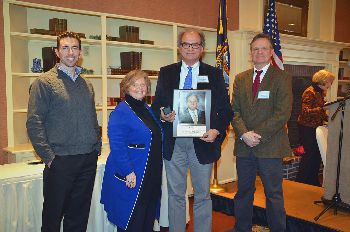 Manchester Memorial High School principal Arthur Adamakos, second from right, received the Charles A. Napoli Principal of the Year Award at the New Hampshire Association of School Principals winter meeting in Meredith. Also pictured is Tom Murphy, far left, representative from Josten's who donates Principal of the Year rings to winners; Peggy McAllister, Executive Director NHASP; and Brian Hastings, President of NHASP. 