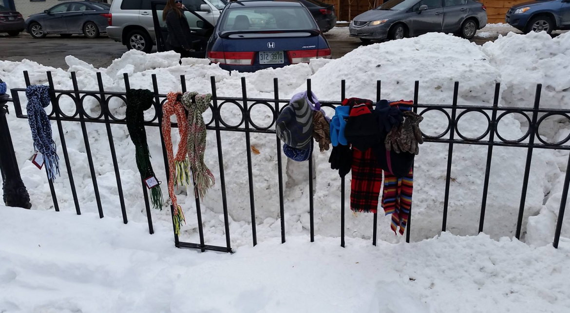Scarves tied to a fence at Veterans Park.