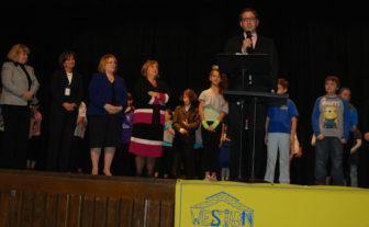 George Scrivanos representing Dunkin Donuts, addresses students and faculty at Weston Elementary.