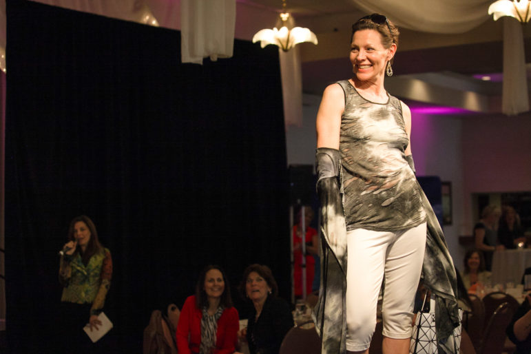 NHPR’s Virginia Prescott poses at the end of the runway during CASA of New Hampshire’s 10th annual Spring Fashion Show and Auction on April 11, 2014. CASA’s largest annual fundraiser, this year’s Fashion Show and Auction will be Friday, April 10. Tickets are available online at www.casanh.org.
