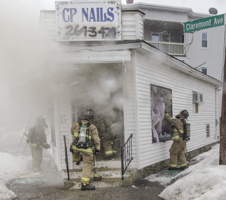 Firefighters working at 47 Martin Street.