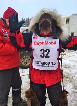 Alyi Zirkle gets a bib adjustment.