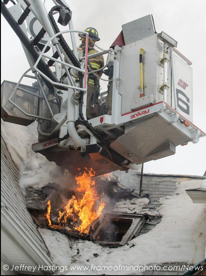 Fire crews attack a fire that re-ignited at 41 Penacook Street on March 5.