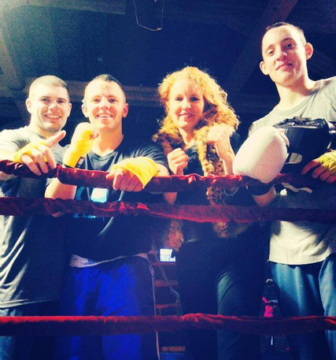 Coach Linda Murphy with some of her boxers from the Golden Gloves New England Championships in Lowell.