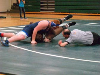 Rick Ross referring a West HS match.