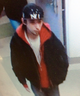 Police are asking the public's help in identifying this man, suspected of taking money from Catholic Medical Center.