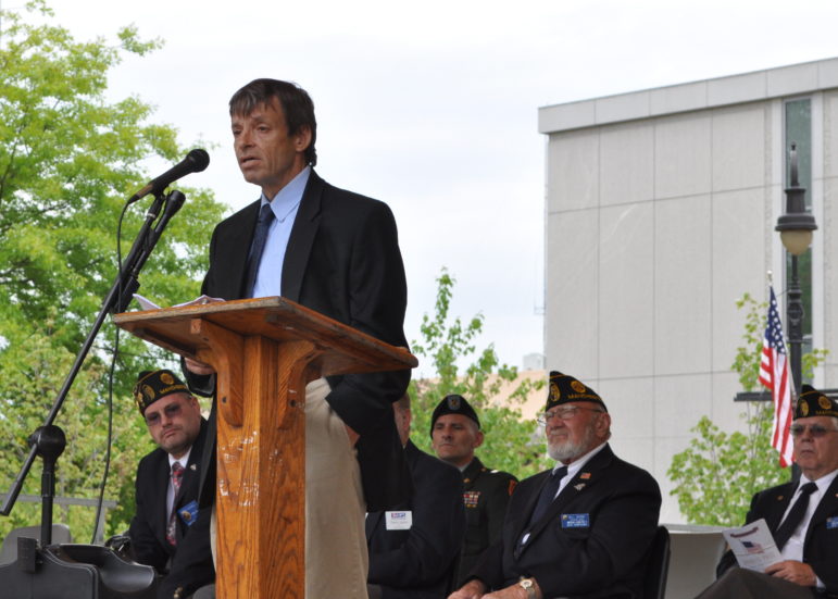 Keith Howard, Executive Director of Liberty House, addresses the post-parade crowd on May 25 at Veterans Park.