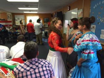 Students prepare for the annual multi-cultural celebration at the Adult Learning Center.