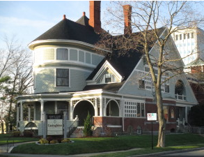 Iconic Chandler House on Bay Street, home to Casinghino Insurance, was damaged in a small porch fire Thursday.