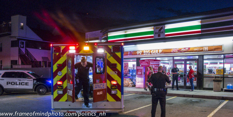 Police staging outside 7-Eleven.