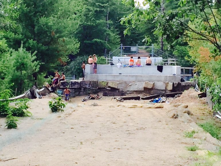 Last hurrah: Hanging out at the former trestle bridge, a ritual of summer for generations of city kids continues.