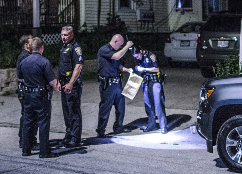 Officers look for evidence of a shooting June 8 on South Street.