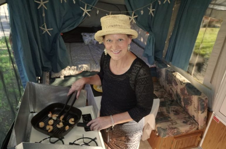 Carolyn cooking in the pop-up.