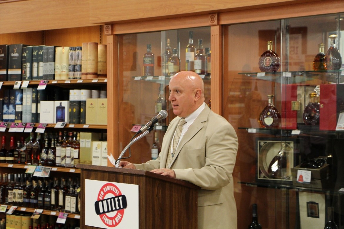NHLC Chairman Joseph Mollica addresses a crowd at the June grand opening of New Hampshireโs largest NH Liquor & Wine Outlet, located at the Rockingham Mall shopping plaza in Salem, NH