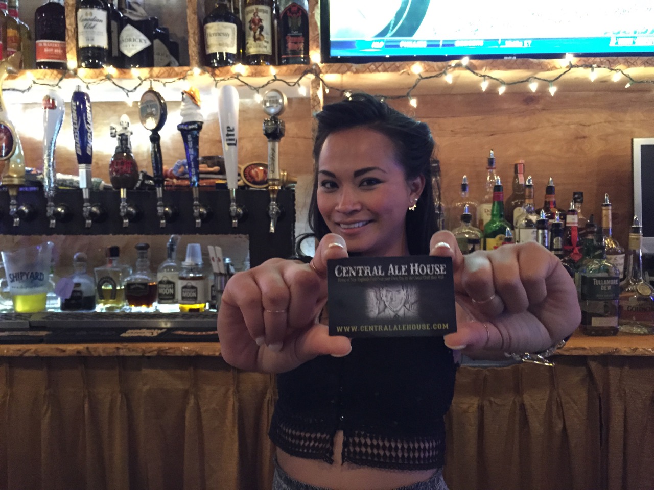 Bar manager Sophea Yay with a Central Ale House  membership card.