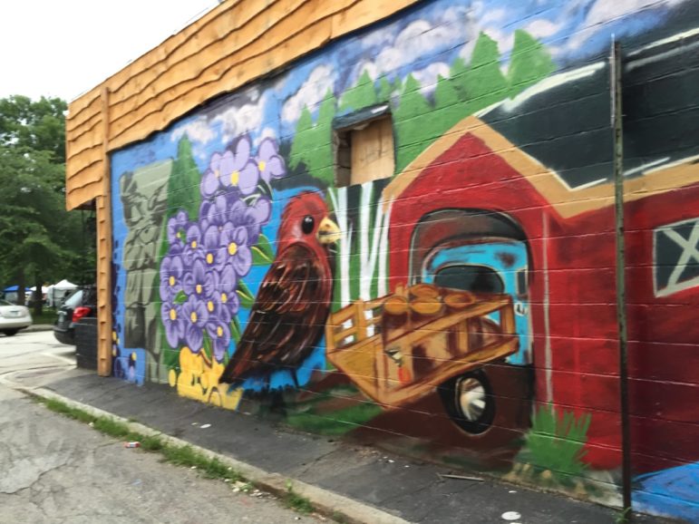 Colorful "graffiti" on an exterior wall perks up the alley next to Central Ale House.