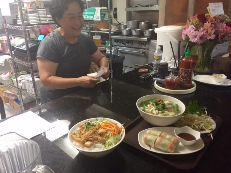 Owner Chan Loi delivers the goods to hungry diners.
