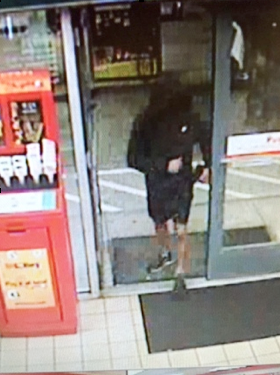 Surveillance photo of robber at Hanover Street Shell station.