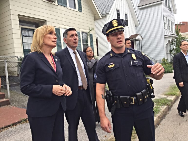 Gov. Maggie Hassan, left, and U.S. Drug Czar Michael Botticelli get the facts on Manchester's heroin crisis from Manchester Police Sgt. Brandon Murphy.
