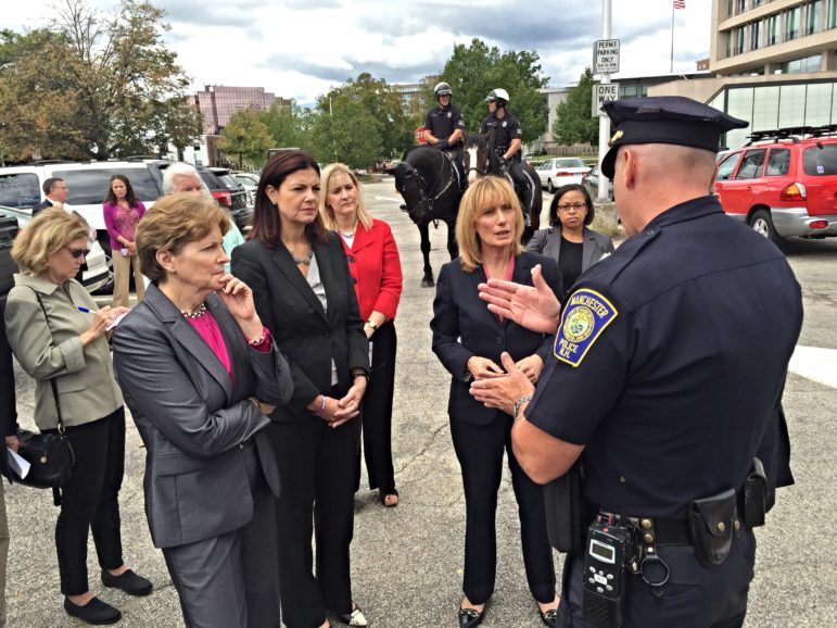 Manchester Police Chief Nick Willard, right, has the attention of, from left, Senators Jeanne Shaheen and Kelly Ayotte, and Gov. Maggie Hassan.
