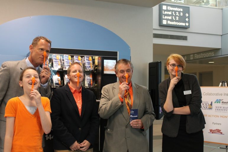 Group #spoonselfies, from left, Elsa Edgar, NH Food Bank Junior Ambassador; J. Brian O’Neill, Deputy Director, Manchester-Boston Regional Airport; Mel Gosselin, NH Food Bank Executive Director; John Dumais, Co-Chairman, NH Food Bank Advisory Committee, and President, NH Grocers Association; and Shannon Scott, of the NH Institute of Art.