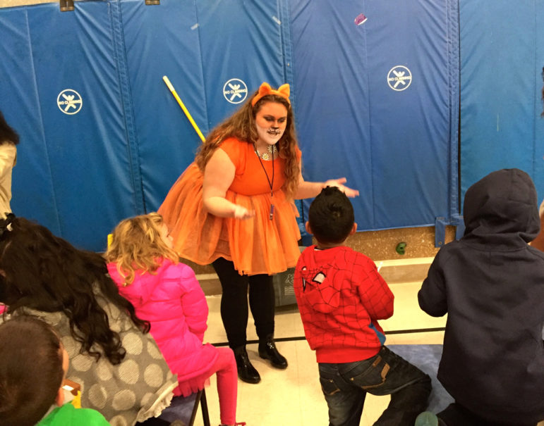 West senior Lauren Boisvert explains her costume to Parker Varney students in advance of Oct. 31 Haunted Hallway.