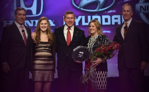 Andy Crews, center, with wife Melissa, right, and daughter Tyler, left.