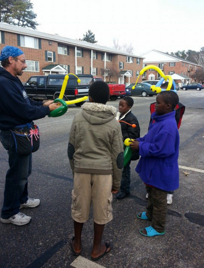 Balloon guy with skills on location during 2014 Shire Sharing distribution day.