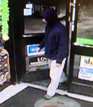 Robber suspect captured on Webster Street 7-Eleven surveillance camera.