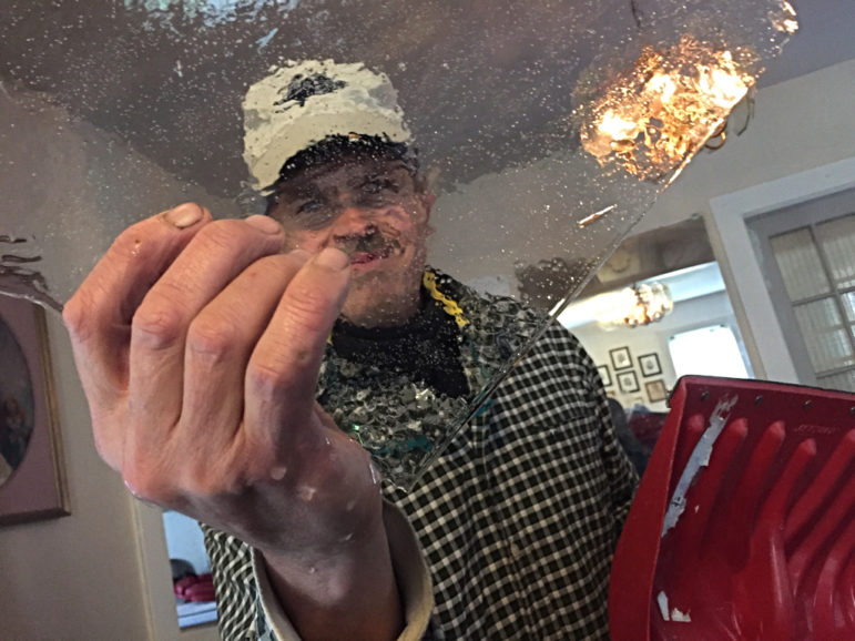 Chief weather watcher Jim Robidoux discovered an Ice dam in the snow shovel during Sunday's minor snow squall.