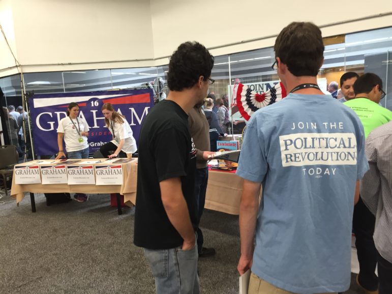 Lots of political labels on T-shirts, campaign buttons bumper stickers and signs at the No Labels convention.
