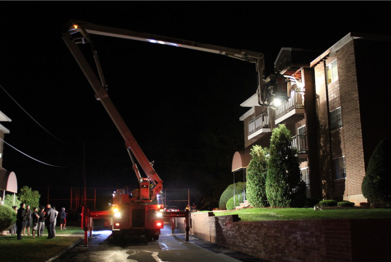 Balcony fire due to improperly disposed of smoking material, according to fire officials.