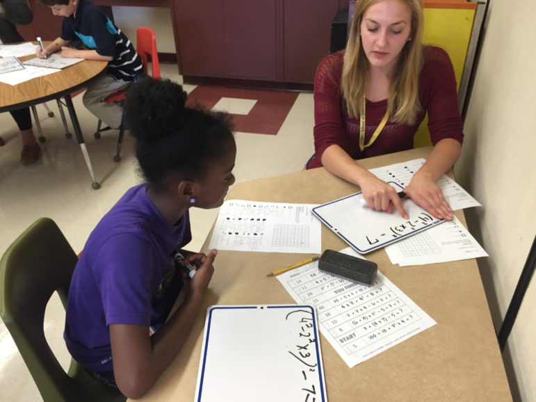 Kristen Wallker puts into practice her student teaching skills with Weston Student Kiyauna.