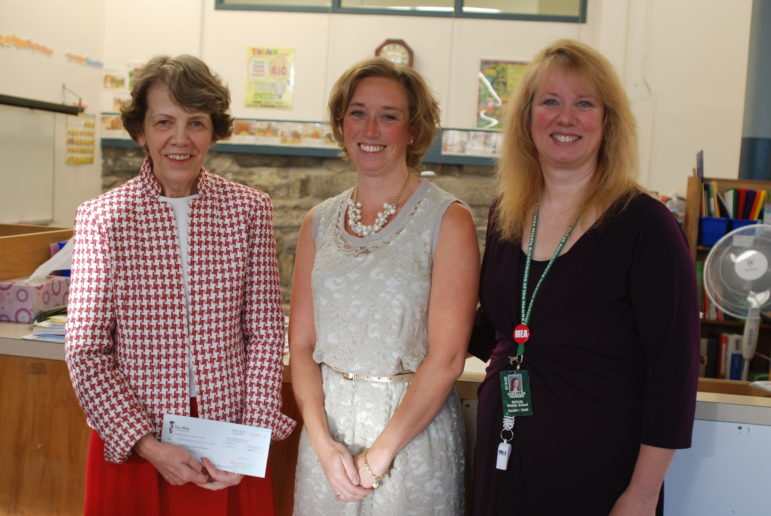 Bakersville Elementary School principal Judy Adams, Lucy Canotas, Manchester Education Association president Sue Hannan