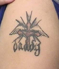 "Daddy" tattoo.