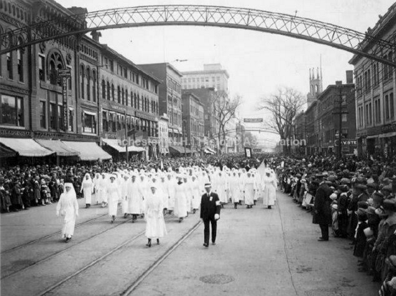 Parades have always taken on a festive air in Manchester, including this one (headed north, incidentally) on Elm Street. (Manchester Historic Association Photo) 