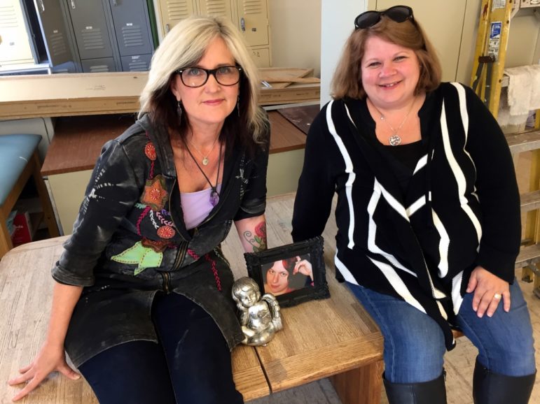 Kriss Blevens, left, and Holly Cekala in the space that will be Amber's Place, a stabilization center for those ready to change their lives. At the center of this dream is Blevens' step-daughter, Amber, who died of heroin, pictured center.